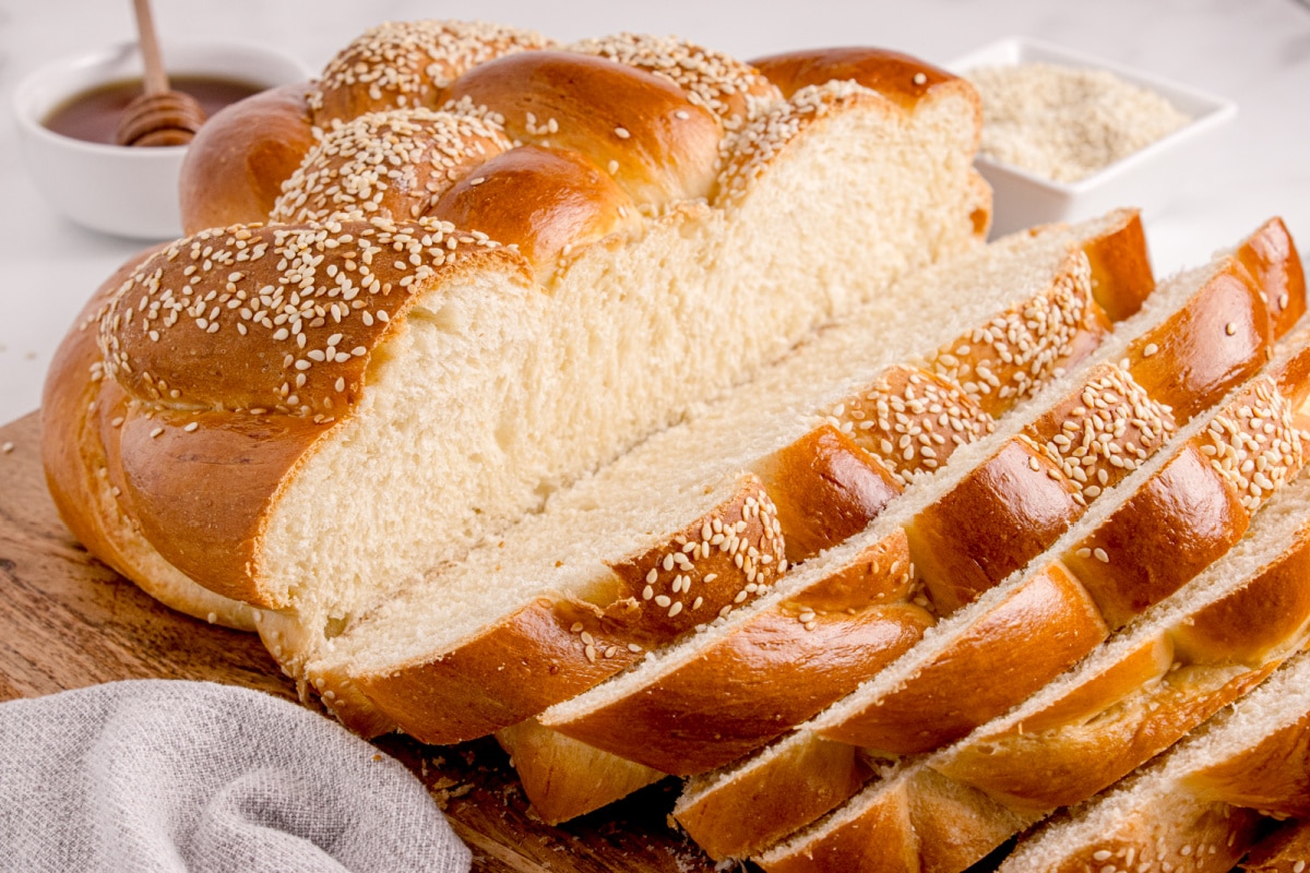 Soft and tender interior of freshly baked round challah Partially sliced round challah loaf showing the soft texture inside