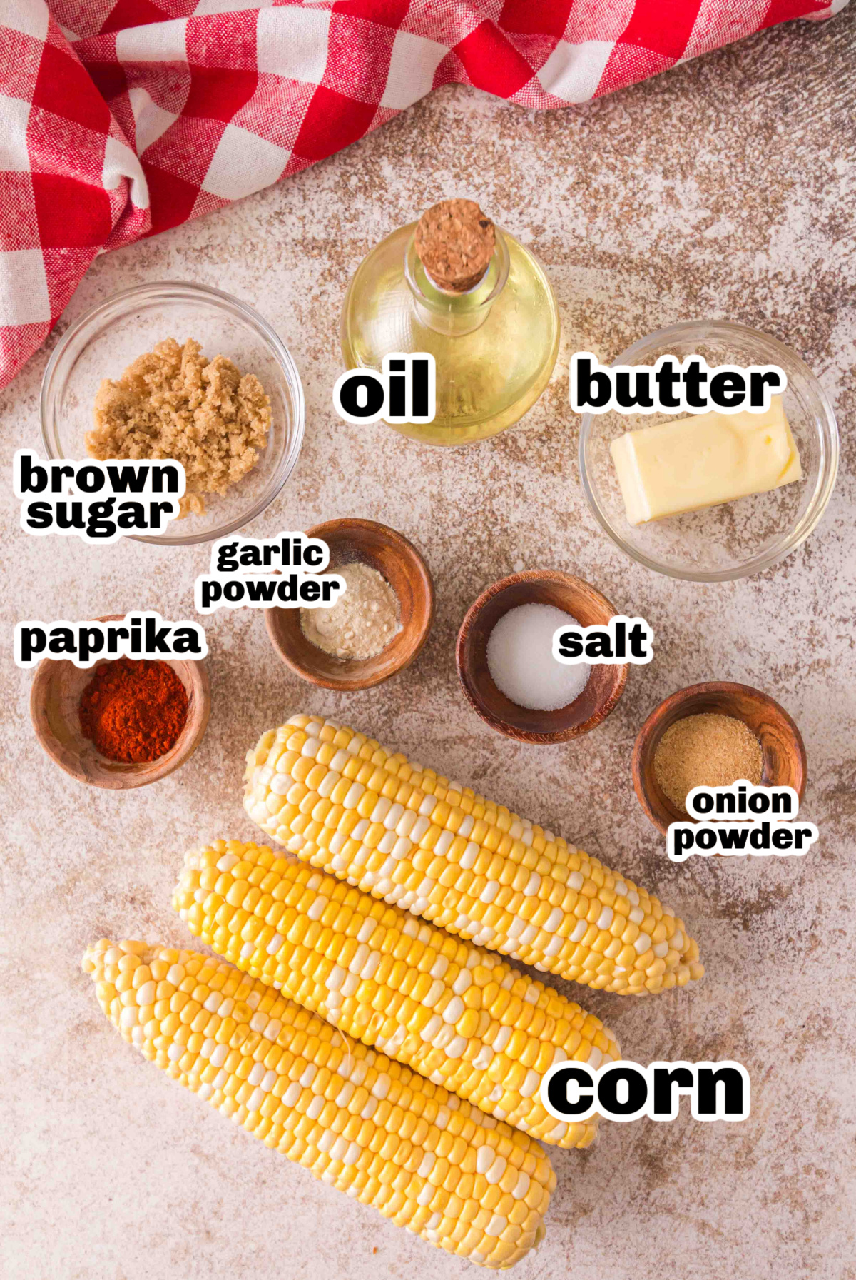 Ingredients for smoked corn on the cob with garlic powder, brown sugar, and butter