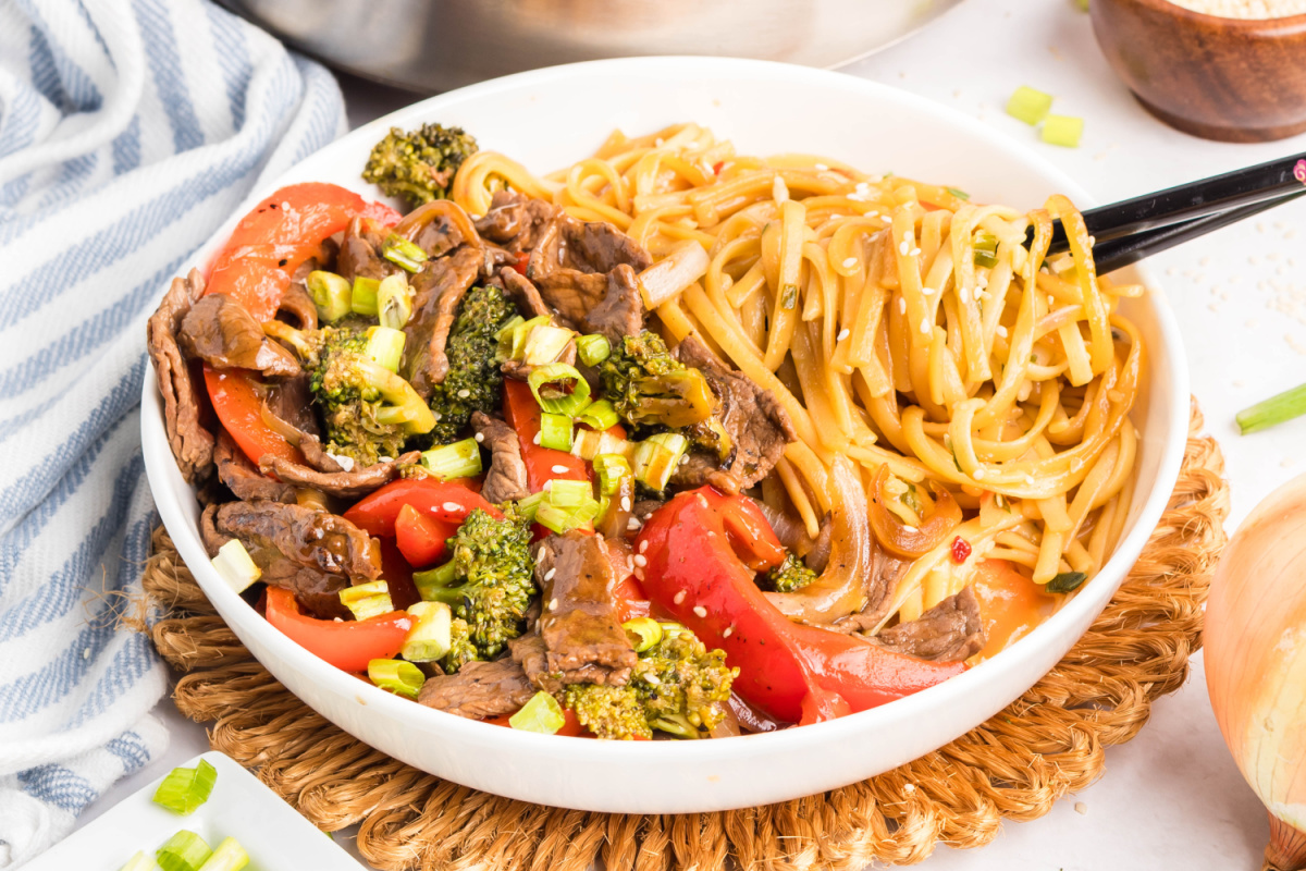 Beef Teriyaki Stir Fry with noodles in a white bowl