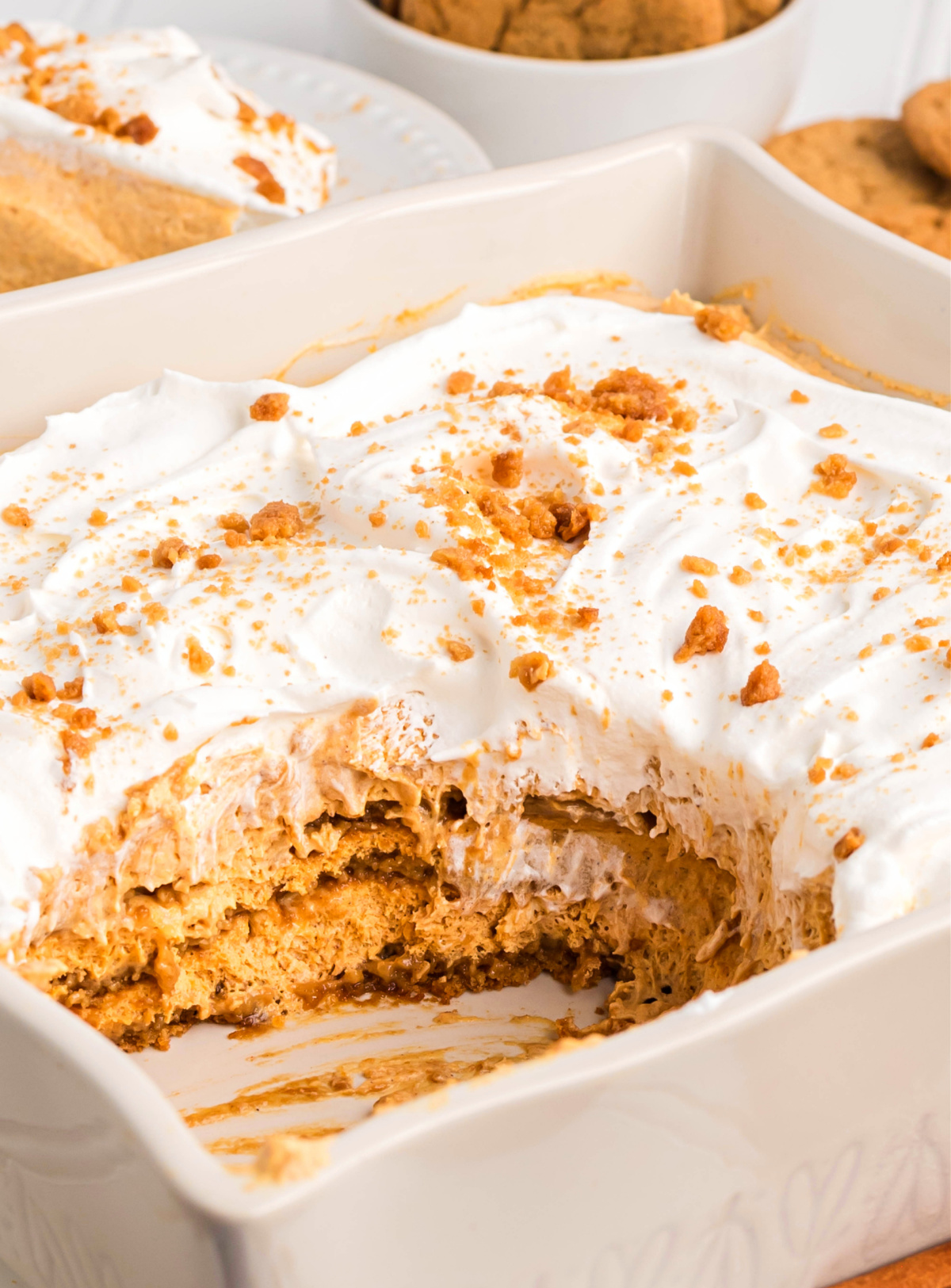 Pumpkin icebox cake with gingersnaps after slicing, layers visible