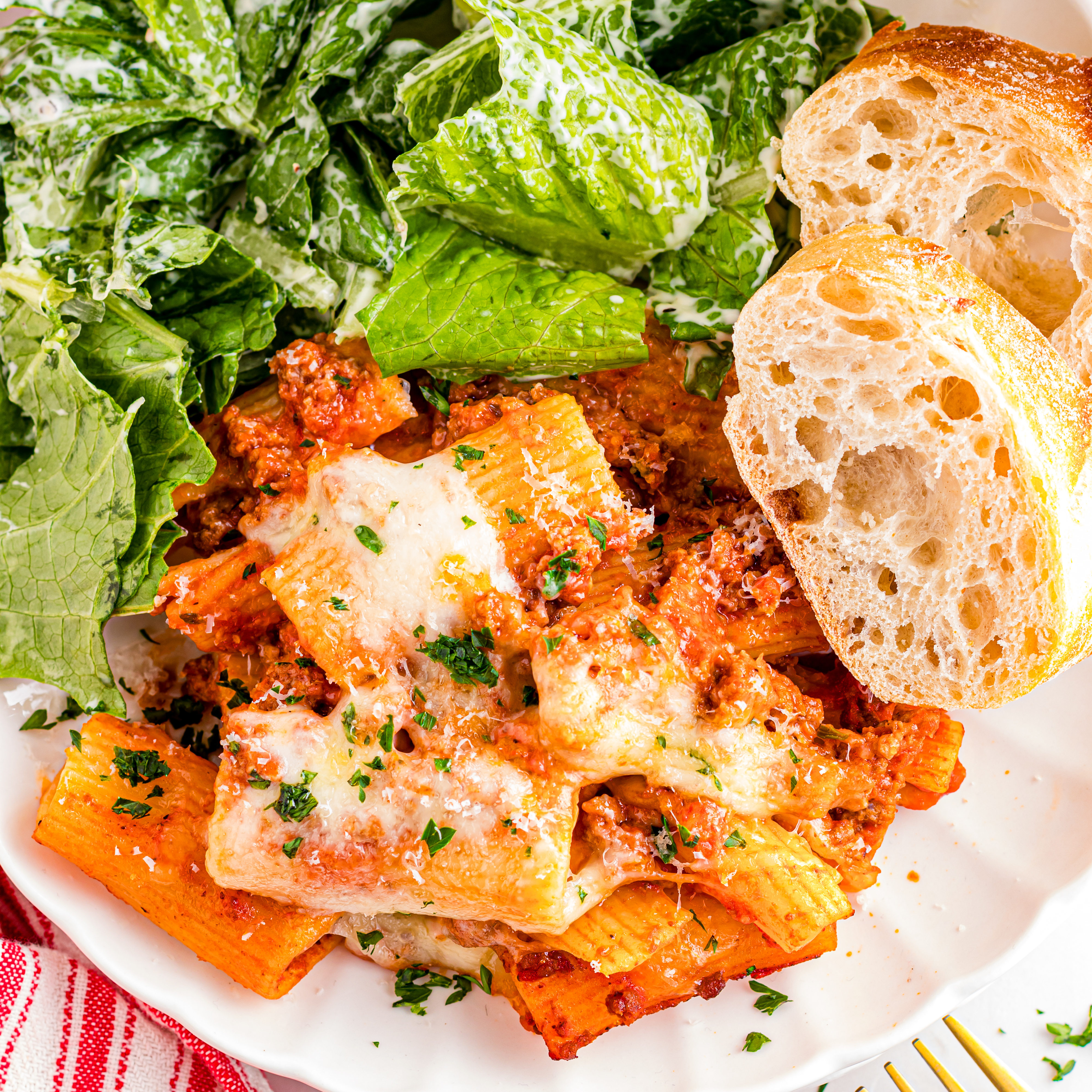 Cheesy baked rigatoni casserole with beef, mozzarella, and red sauce baked until bubbling and golden