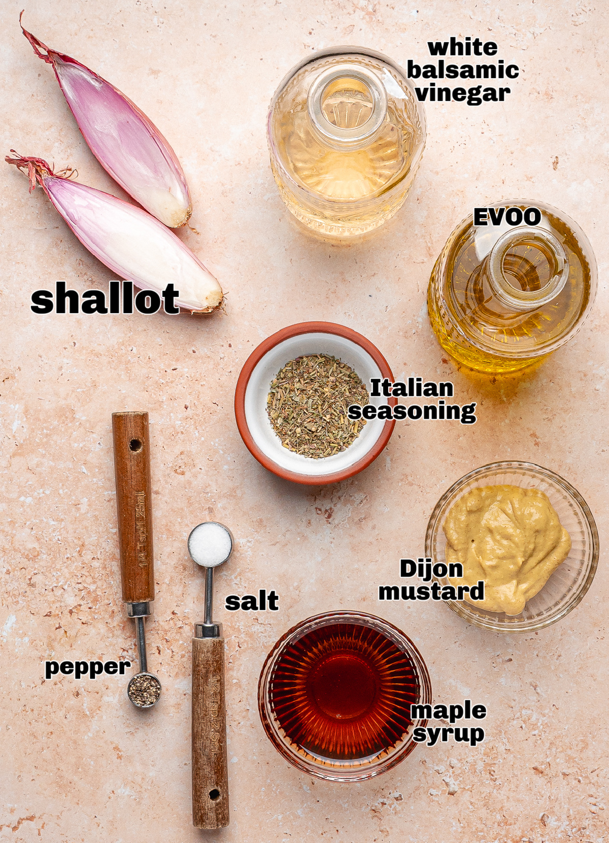 White Balsamic Dressing Ingredients Ingredients for white balsamic dressing including olive oil, vinegar, Dijon, maple syrup, and shallot