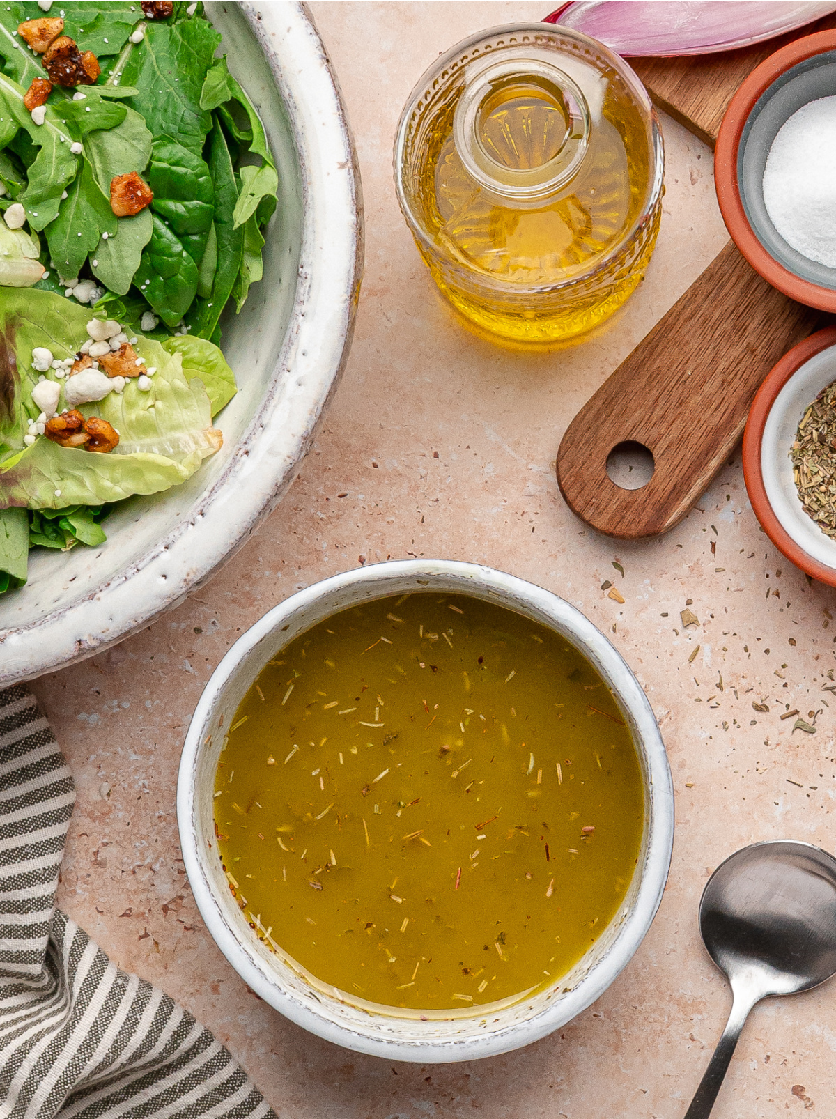 Homemade White Balsamic Vinaigrette Bowl of homemade white balsamic vinaigrette with olive oil and herbs