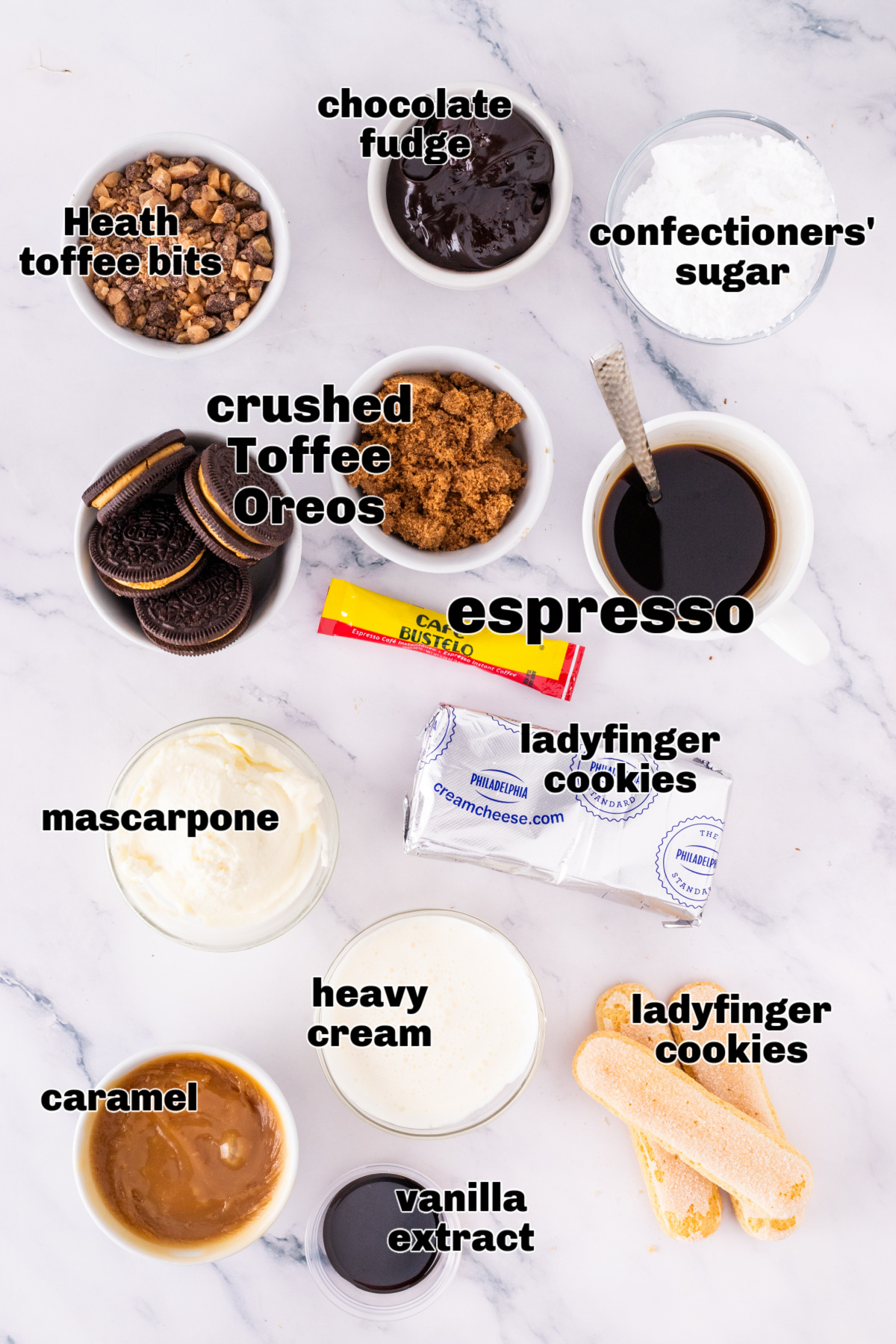 Ingredients for toffee tiramisu including espresso, mascarpone, caramel, heavy cream, cream cheese, ladyfingers, confectioners’ sugar, and crushed Toffee Crunch OREOs.