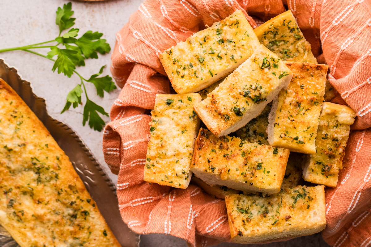 Chunks of garlic confit air fryer bread piled together while still warm and crisp Garlic confit air fryer bread cut into pieces with crisp edges and a soft center
