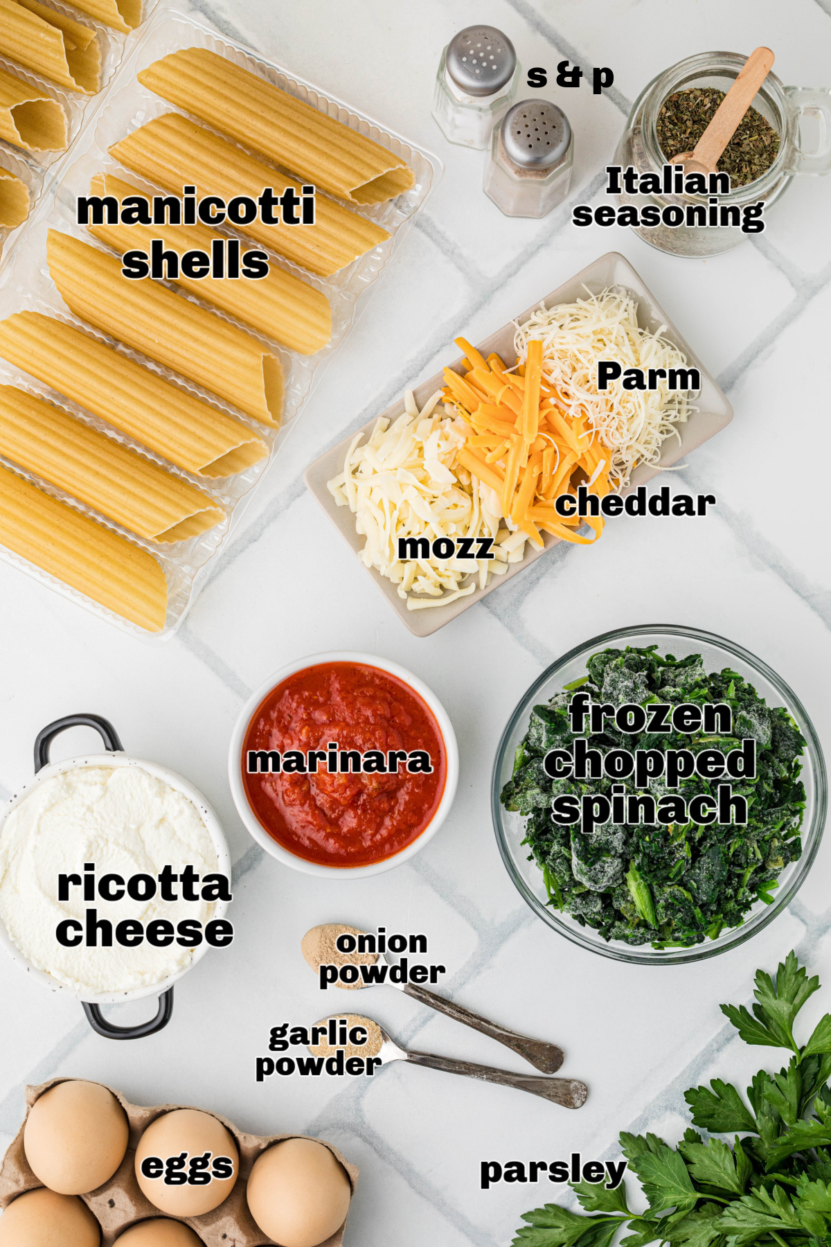 Ingredients for ricotta spinach manicotti including pasta shells, cheeses, marinara sauce, spinach, eggs, and seasonings