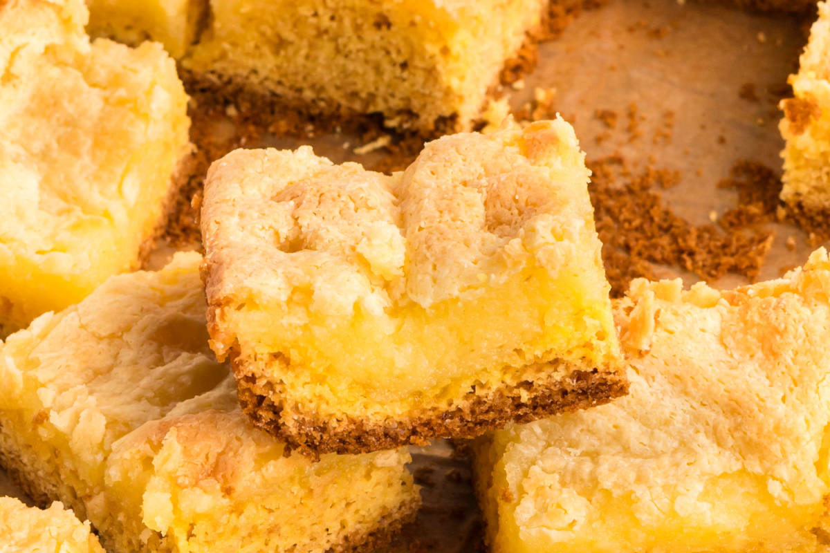 Gooey butter cake close-up showing creamy center and soft cake layers. Close-up of gooey butter cake showing the creamy center, tender cake layer, and lightly crisped top.