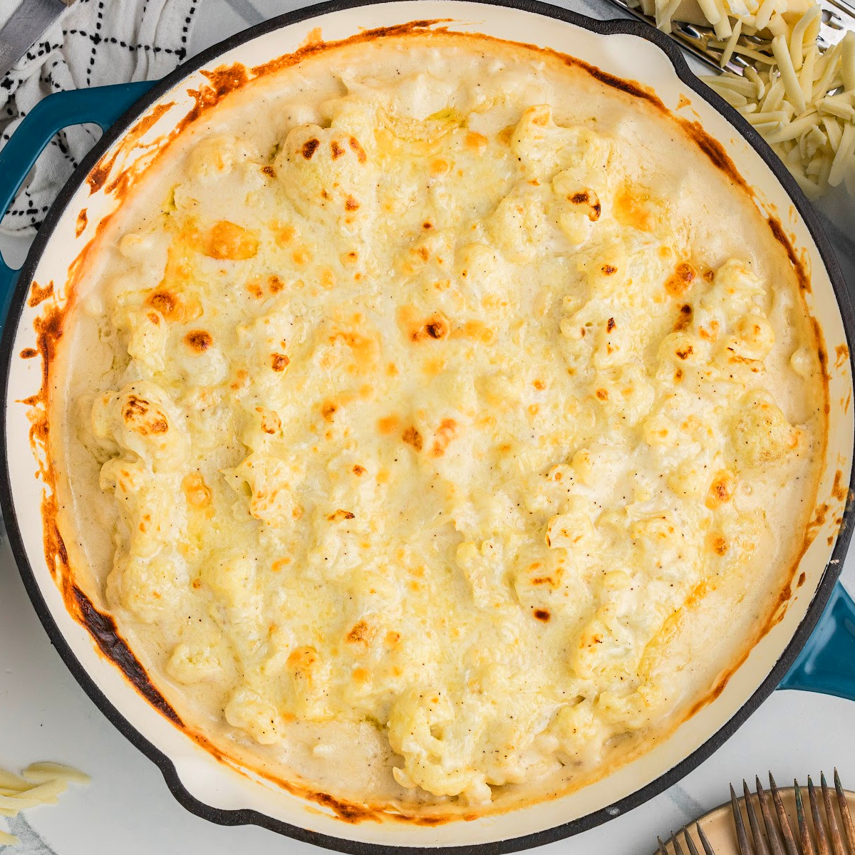 Cauliflower mac and cheese baked until golden, with a thick, creamy cheese sauce and bubbling edges.