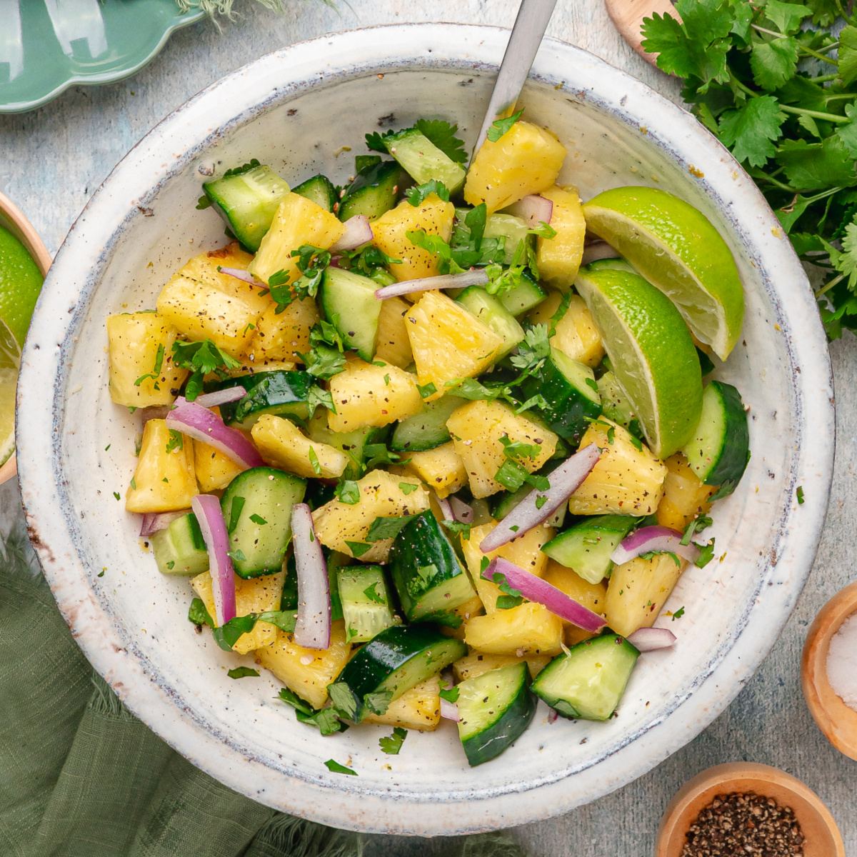 Chilled pineapple cucumber salad with cucumbers, pineapple, and lime dressing