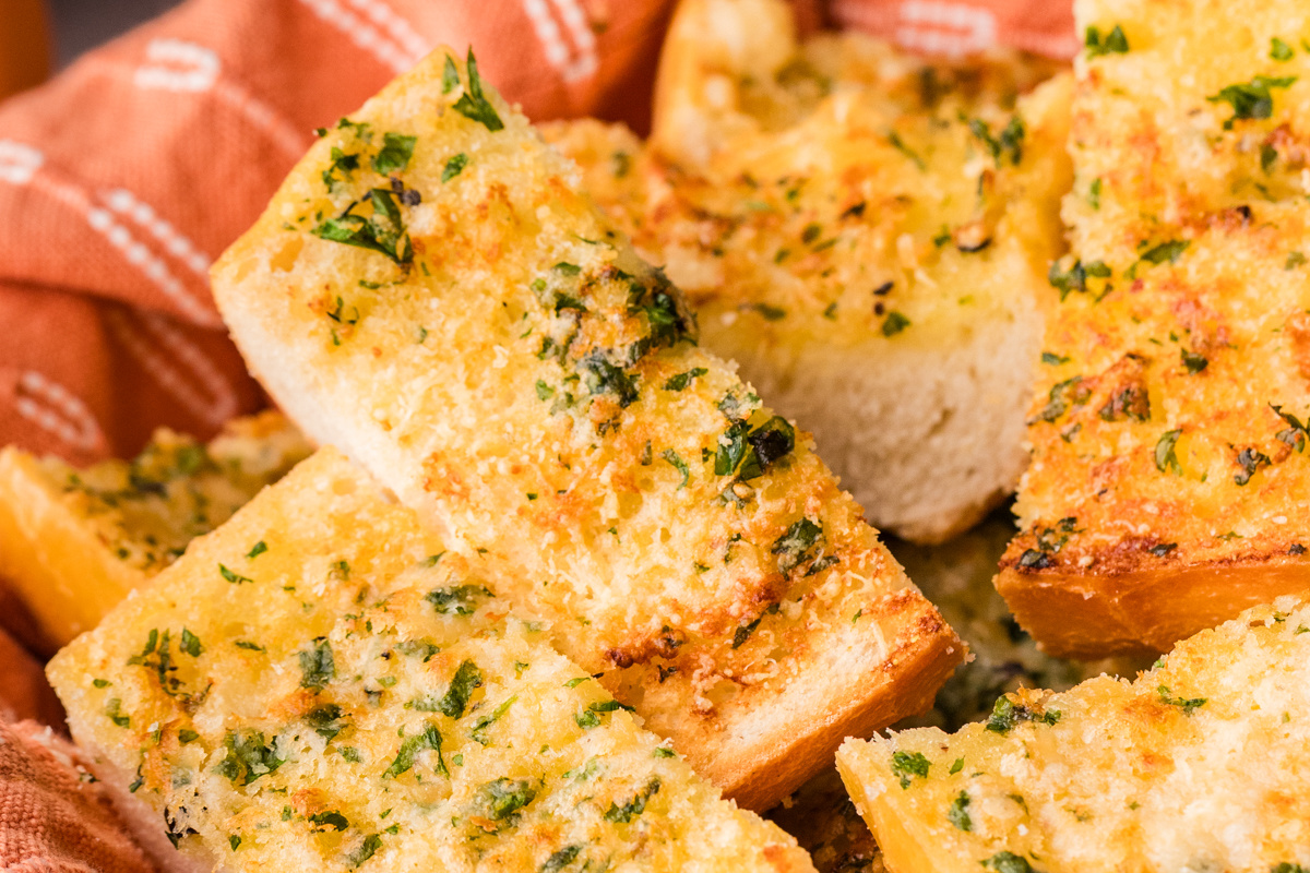 Close-up of crispy garlic bread made with garlic confit, showing golden crumb and soft interior Close-up of crispy garlic bread made with garlic confit, showing golden crumb and soft interior