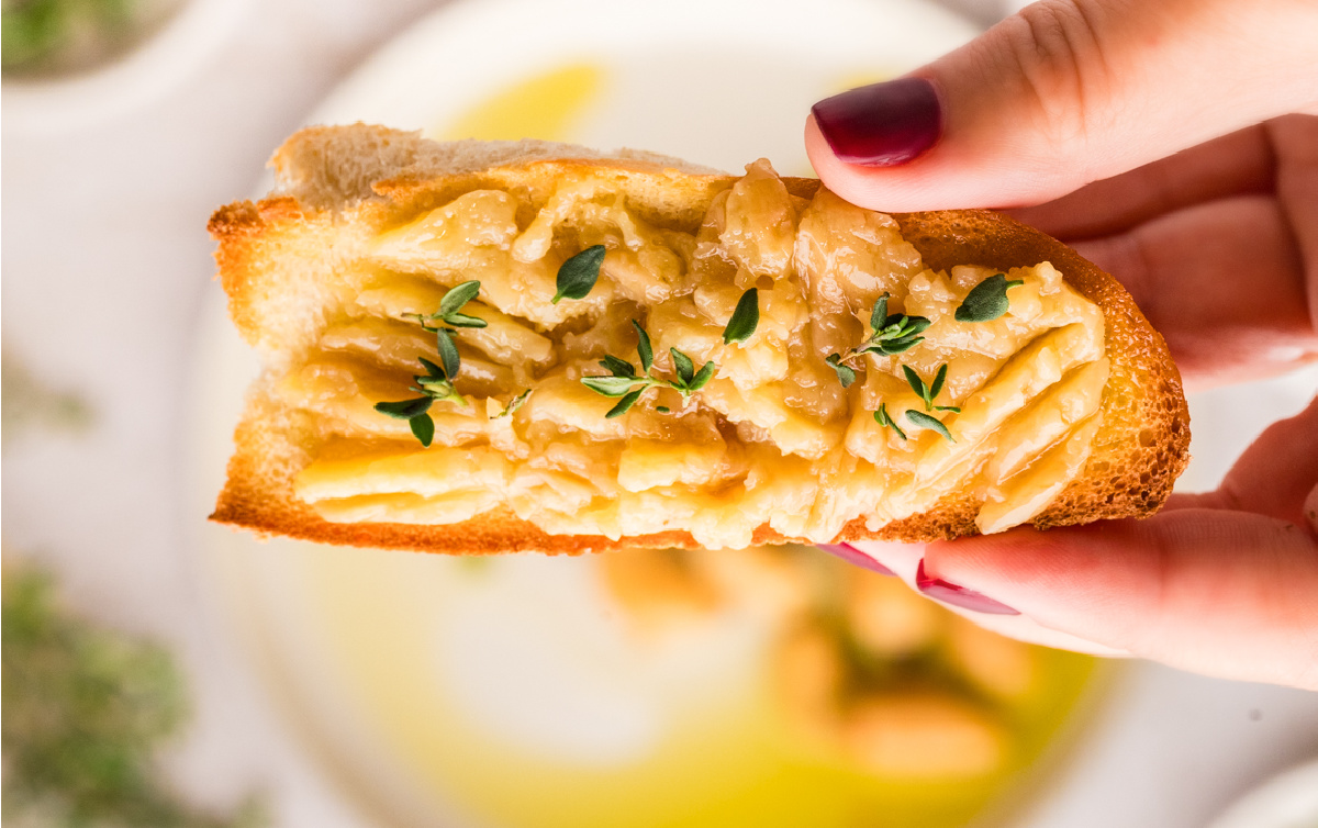 Toast topped with soft mashed garlic and infused olive oil. Garlic cloves mashed and spread over toasted bread with olive oil and thyme.