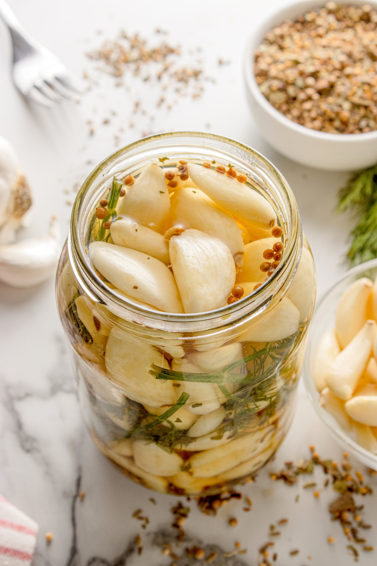 Pickled Dill Garlic Pickled Dill Garlic in a mason jar with dill and pickling spice