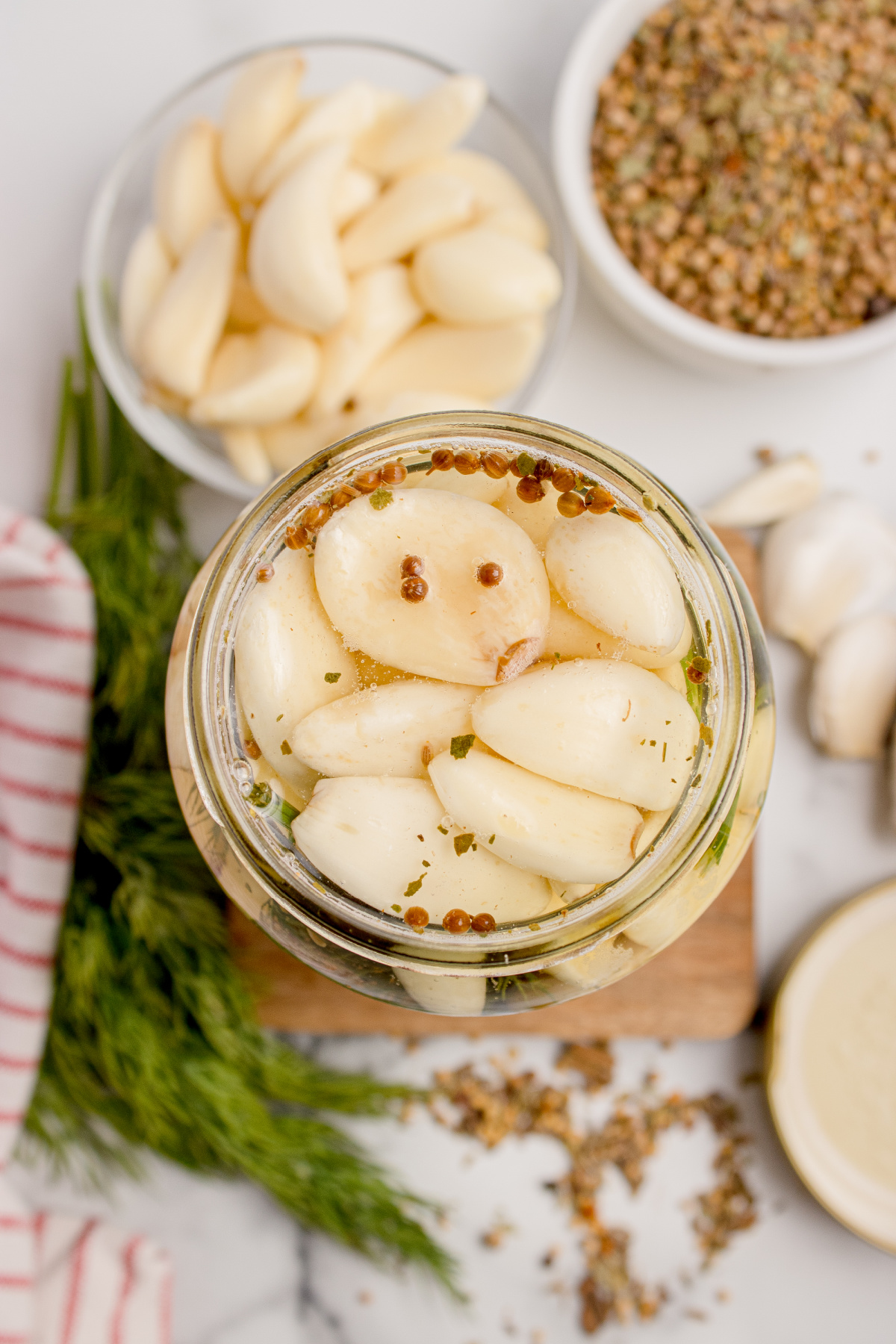 Refrigerator pickled garlic Overhead view of refrigerator pickled garlic cloves in brine