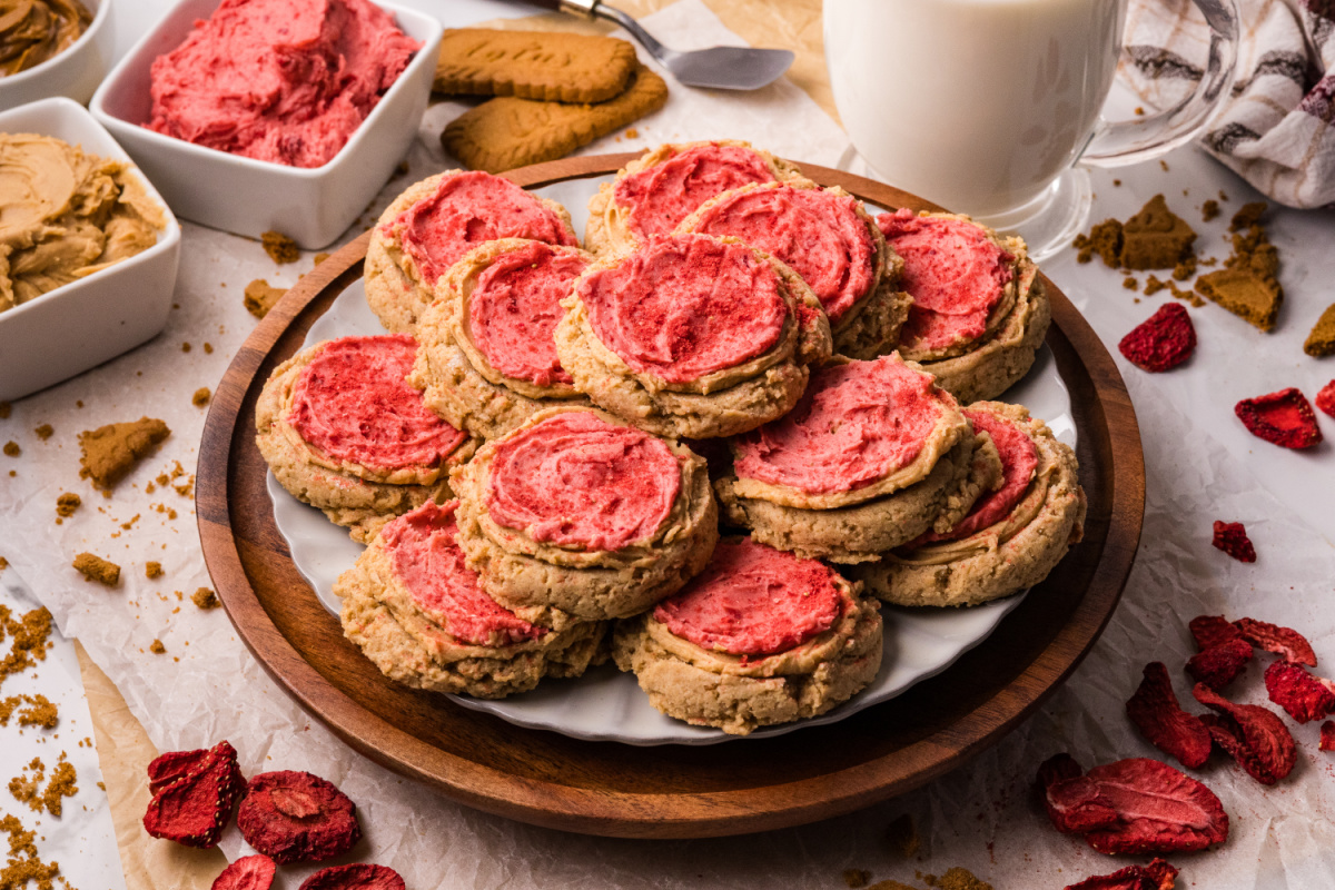 Biscoff Butter Cookies on a Plate Biscoff butter cookies on a plate with cookie butter and freeze-dried strawberries nearby