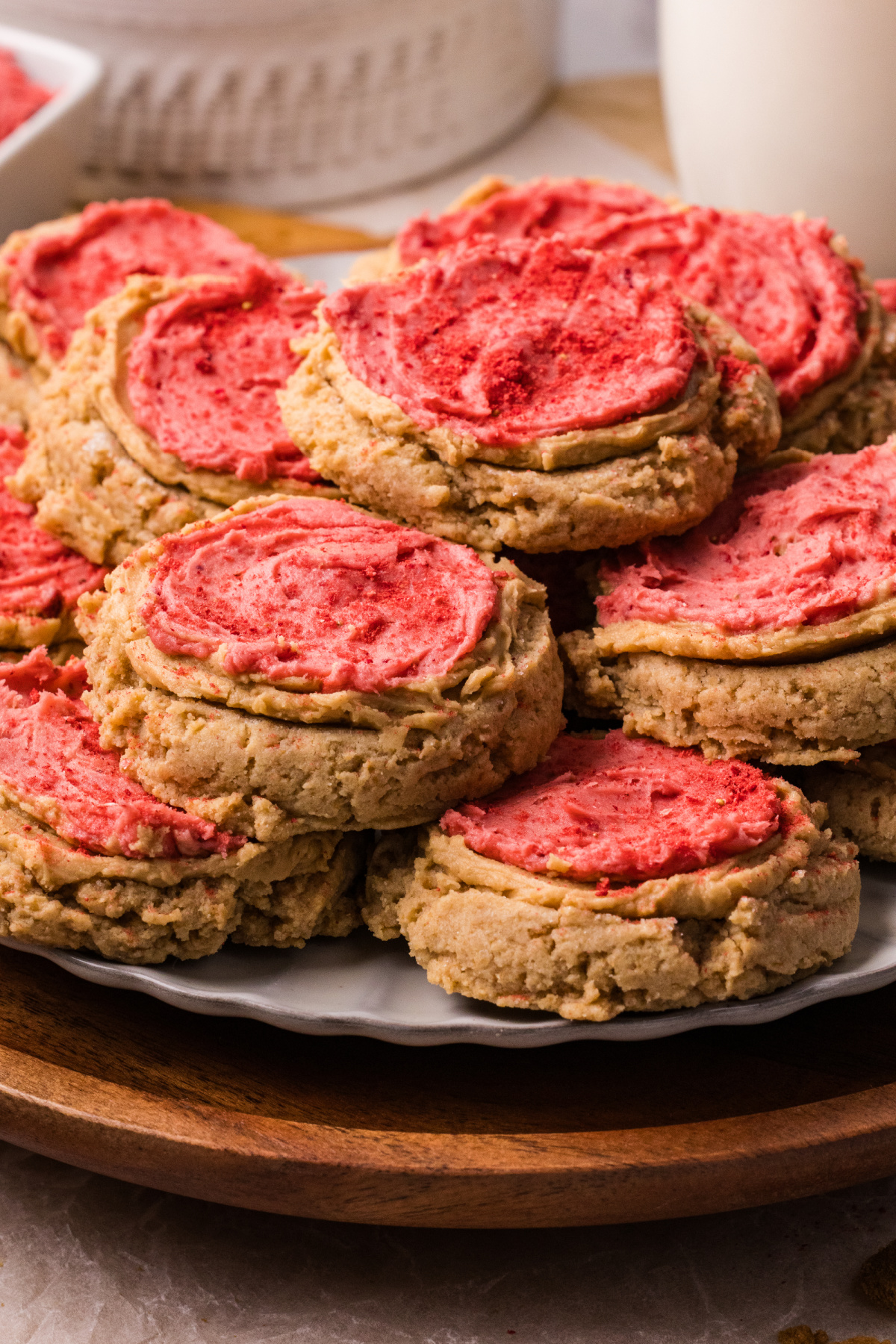Biscoff Butter Cookies with Strawberry Frosting Biscoff butter cookies with strawberry frosting stacked on a plate