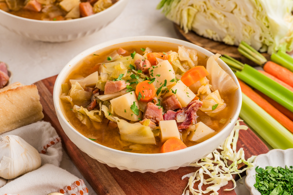 Ham and cabbage soup in a bowl Ham and cabbage soup with potatoes, carrots, cabbage, and ham in a brothy bowl
