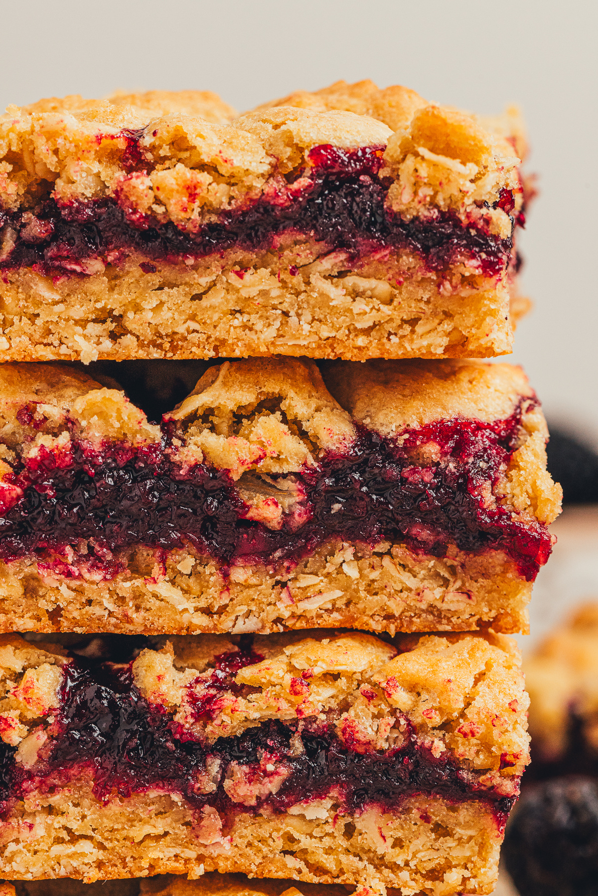 Blackberry crumble bars stacked with a rich blackberry layer and oat crumble topping blackberry crumble bars stacked showing thick blackberry layer and oat crumble topping