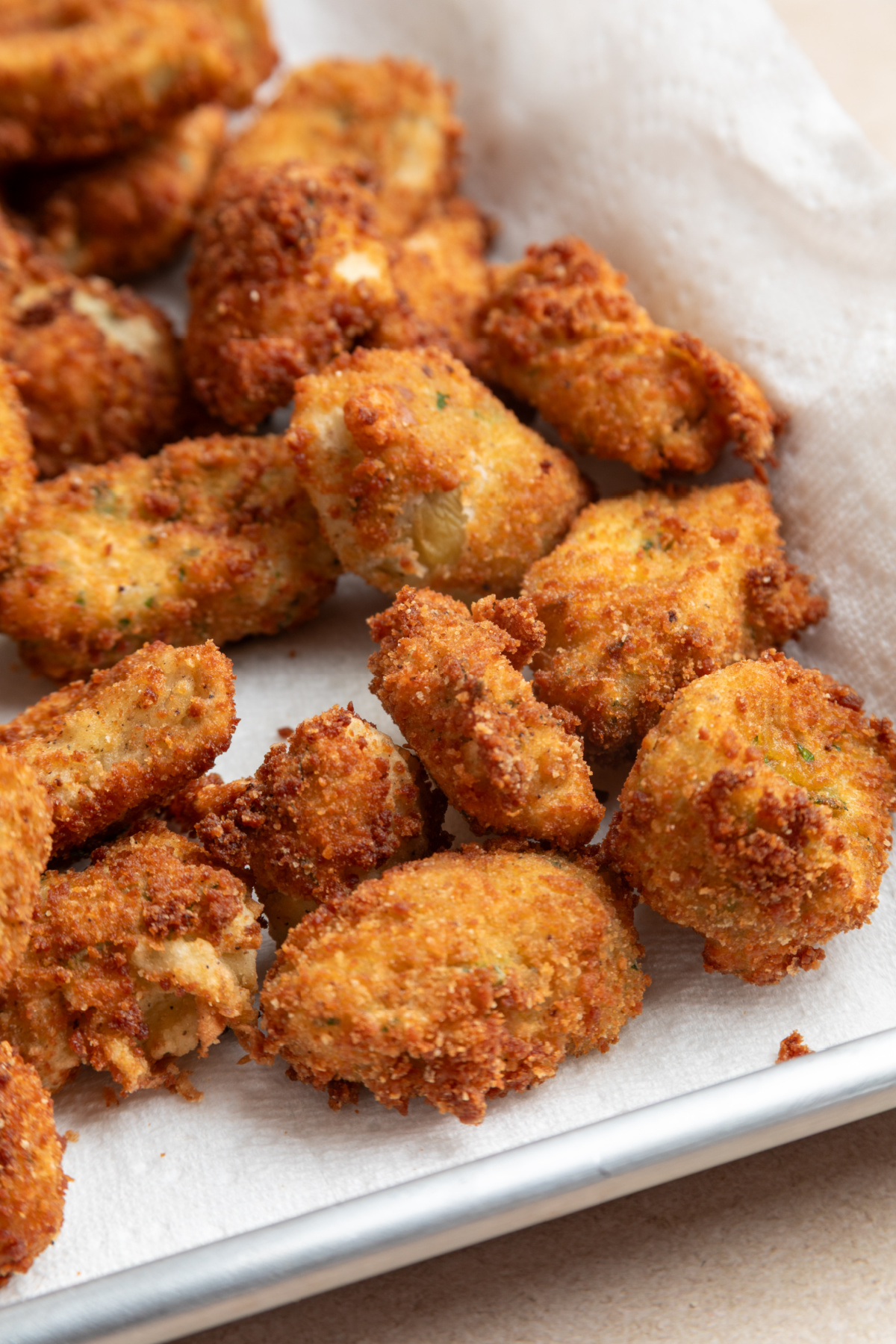 Freshly fried artichokes with a crisp, golden coating Crispy fried artichokes with a golden breadcrumb coating fresh from frying
