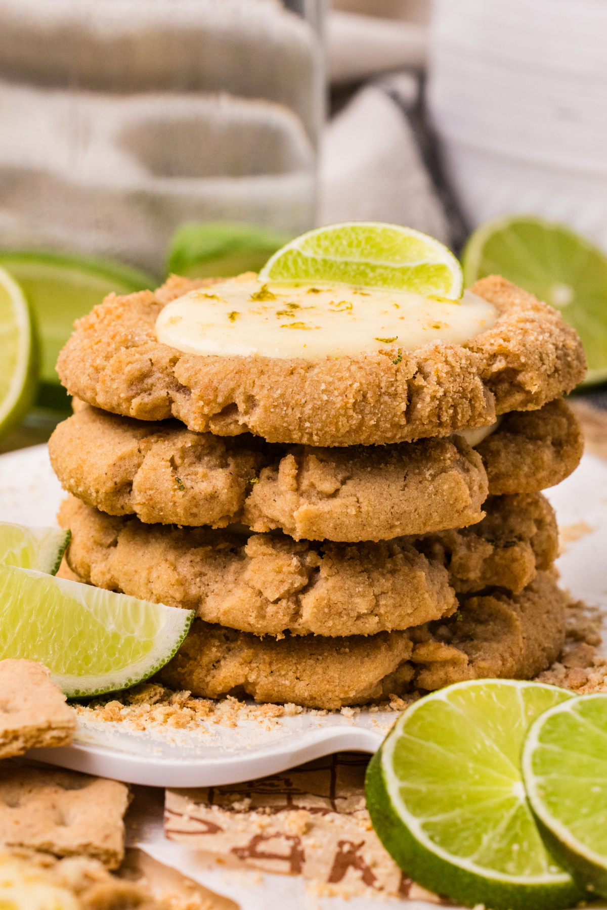 stacked lime cookies with crumb coating and citrus topping stacked graham cracker cookies with creamy lime filling and fresh lime slices