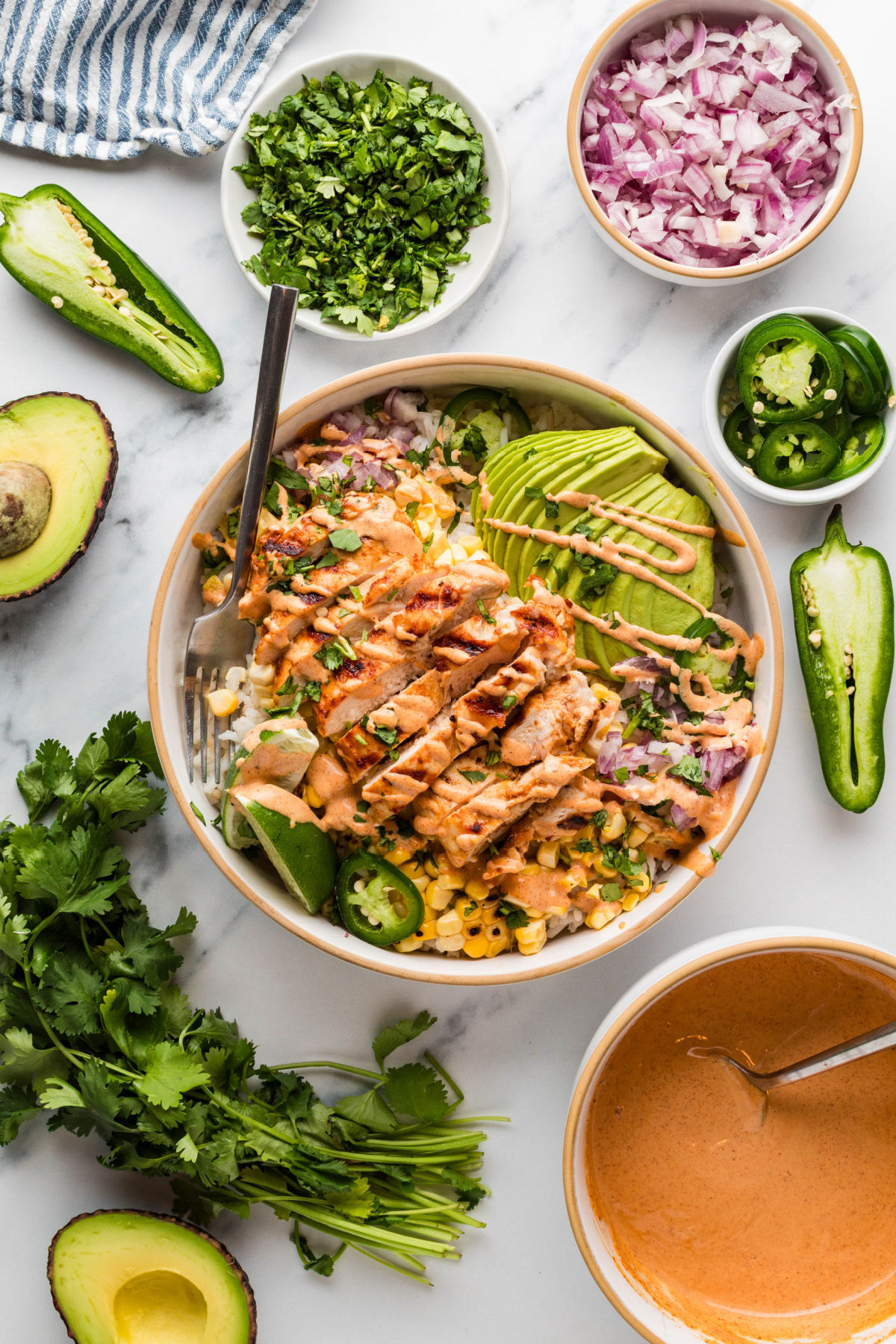 street corn chicken bowl with fresh toppings and lime crema street corn chicken rice bowls with grilled chicken, charred corn, avocado, cilantro, jalapeños, and creamy elote-style sauce