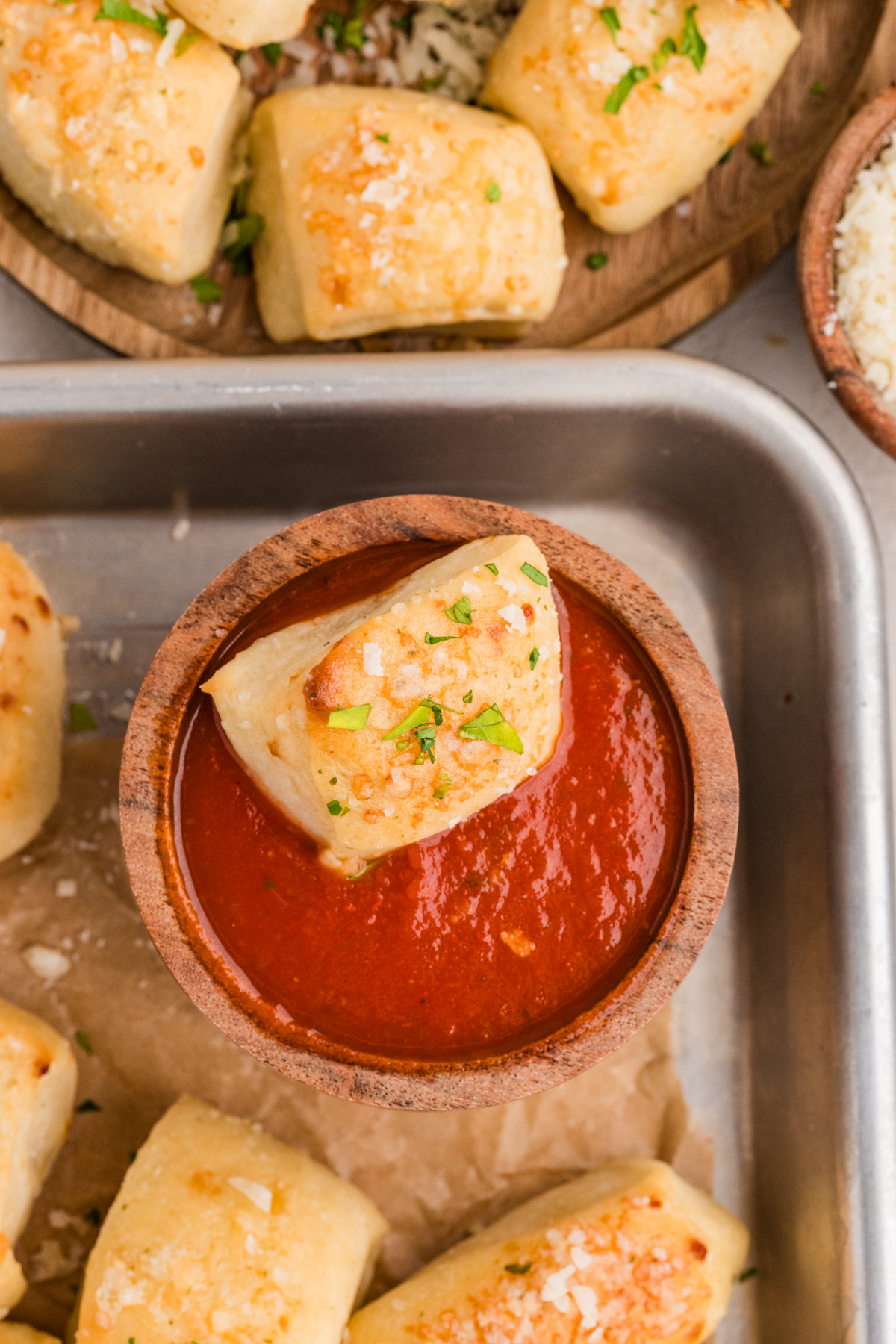 Parmesan bread bite served with marinara dipping sauce