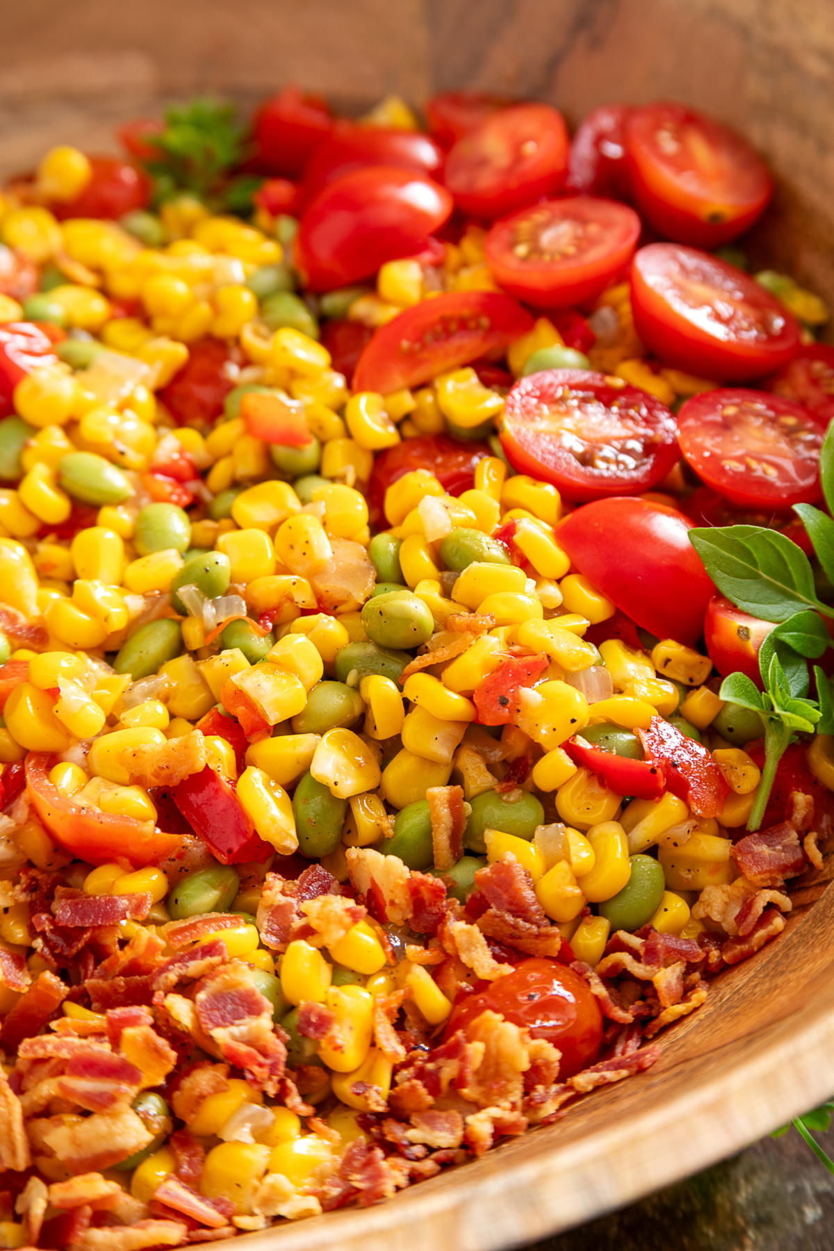 close-up of corn succotash Close-up of succotash with edamame, sweet corn, tomatoes, peppers, and crispy bacon