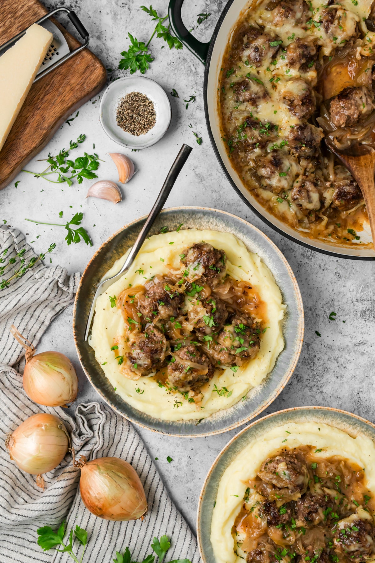 French onion meatballs with caramelized onions and Gruyère served over mashed potatoes
