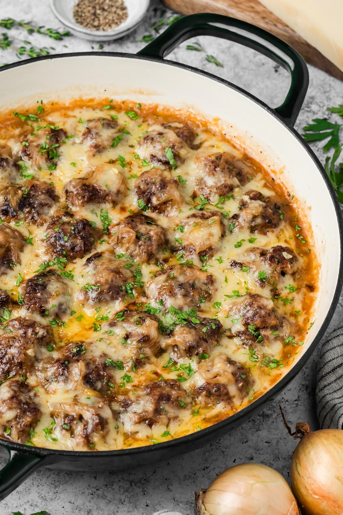 Beef meatballs with caramelized onions and melted Gruyère in a French onion sauce