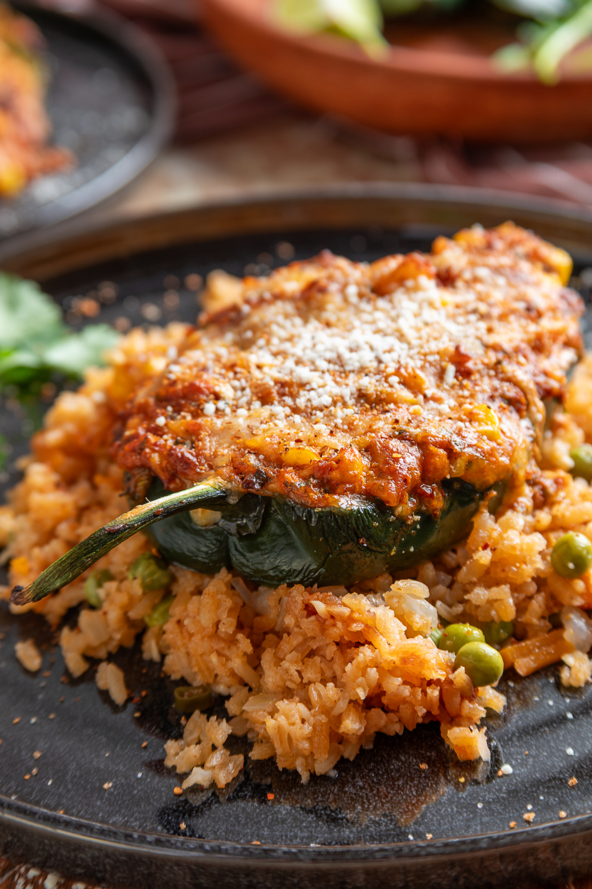 Mexican street corn stuffed poblano peppers with chorizo, corn, melted cheese, Cotija and Tajín