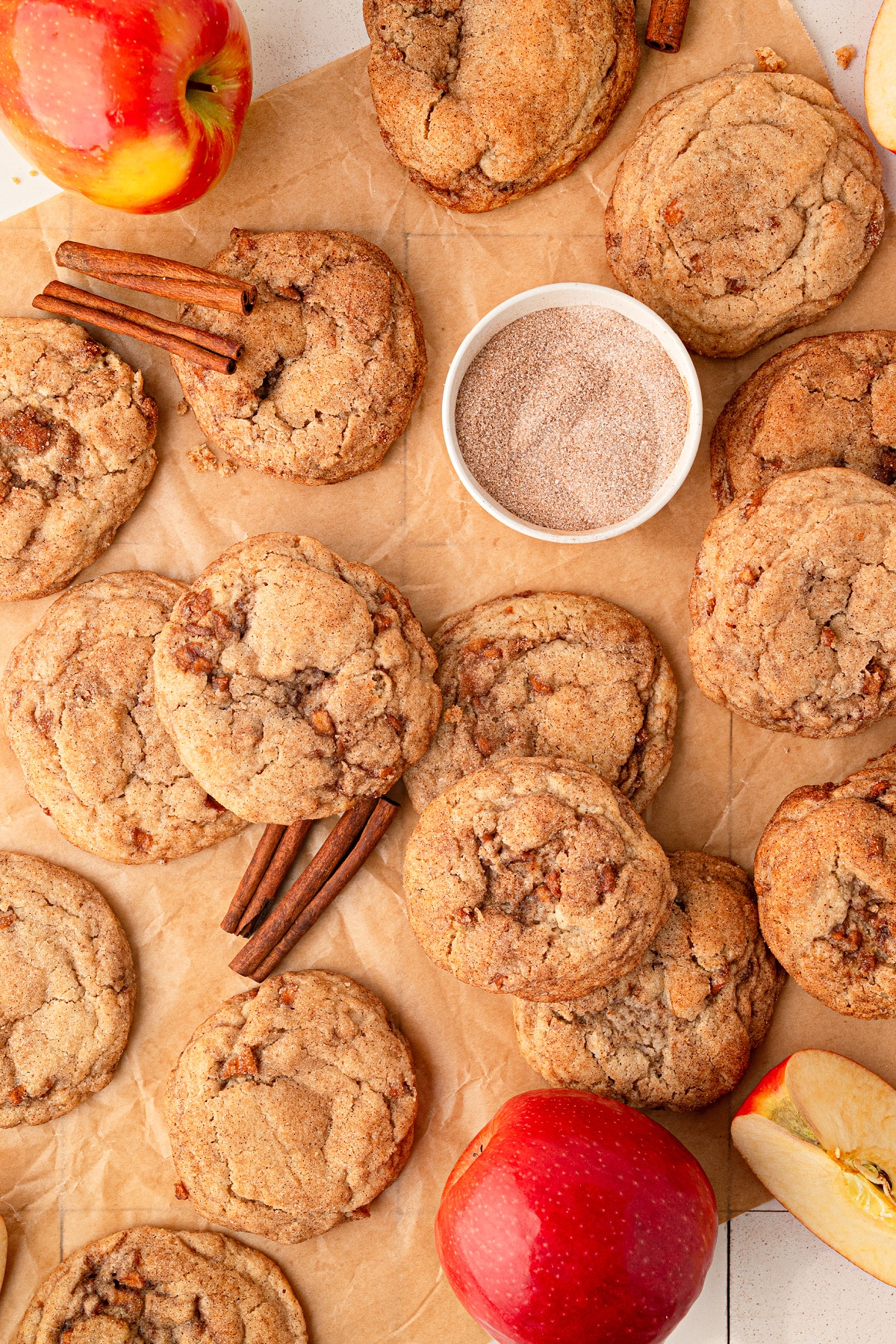Thick apple snickerdoodle cookies made with buttery cinnamon-spiced apples and rolled in cinnamon sugar. Apple snickerdoodles with cinnamon sugar and fresh Honeycrisp apples