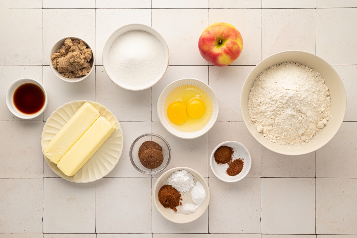 Ingredients for homemade apple snickerdoodles with fresh apple, butter, brown sugar, cinnamon and cream of tartar. Ingredients for apple snickerdoodles including fresh apple, flour, butter, sugars, eggs and cinnamon