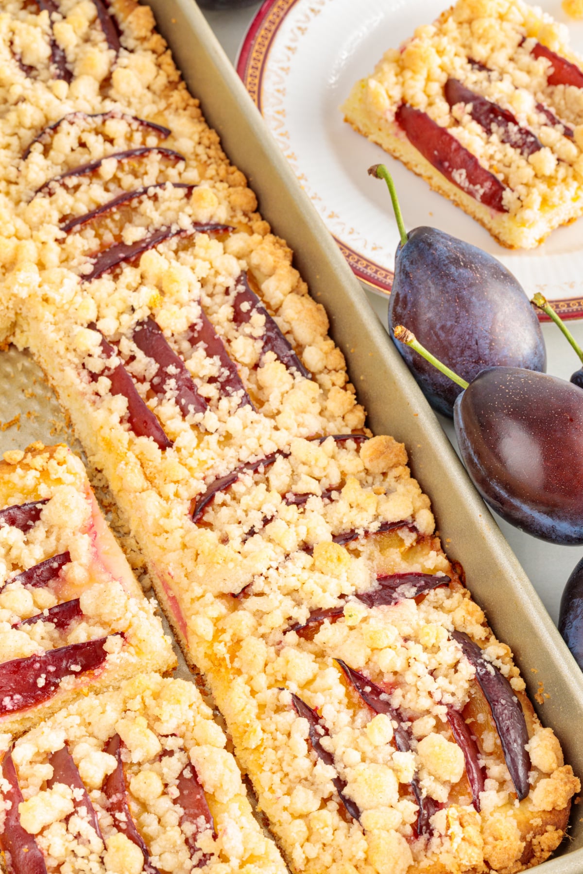 Sliced German Plum Cake with Streusel Sliced German plum cake with streusel, prune plums and a thin yeasted cake base.