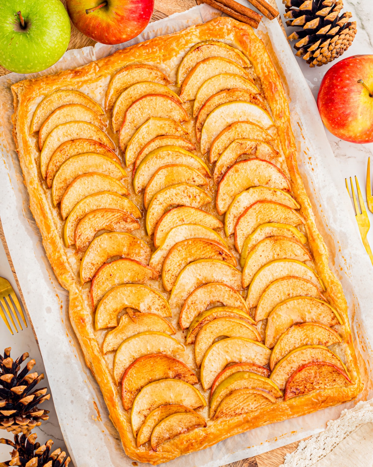 Puff pastry apple tart with thinly sliced apples, cinnamon and a golden pastry border