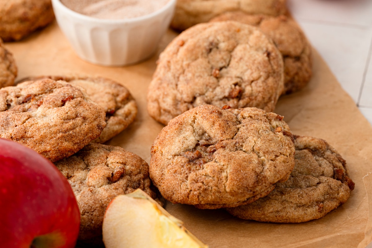 Soft, chewy cinnamon cookies with buttery spiced apple pieces throughout and cinnamon sugar on the outside. Thick cinnamon apple cookies with visible pieces of cooked Honeycrisp apple